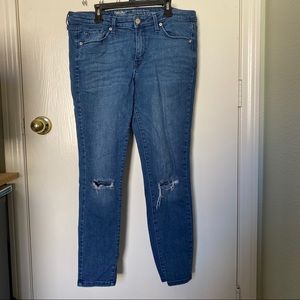 RIPPED MID-RISE SKINNY JEANS